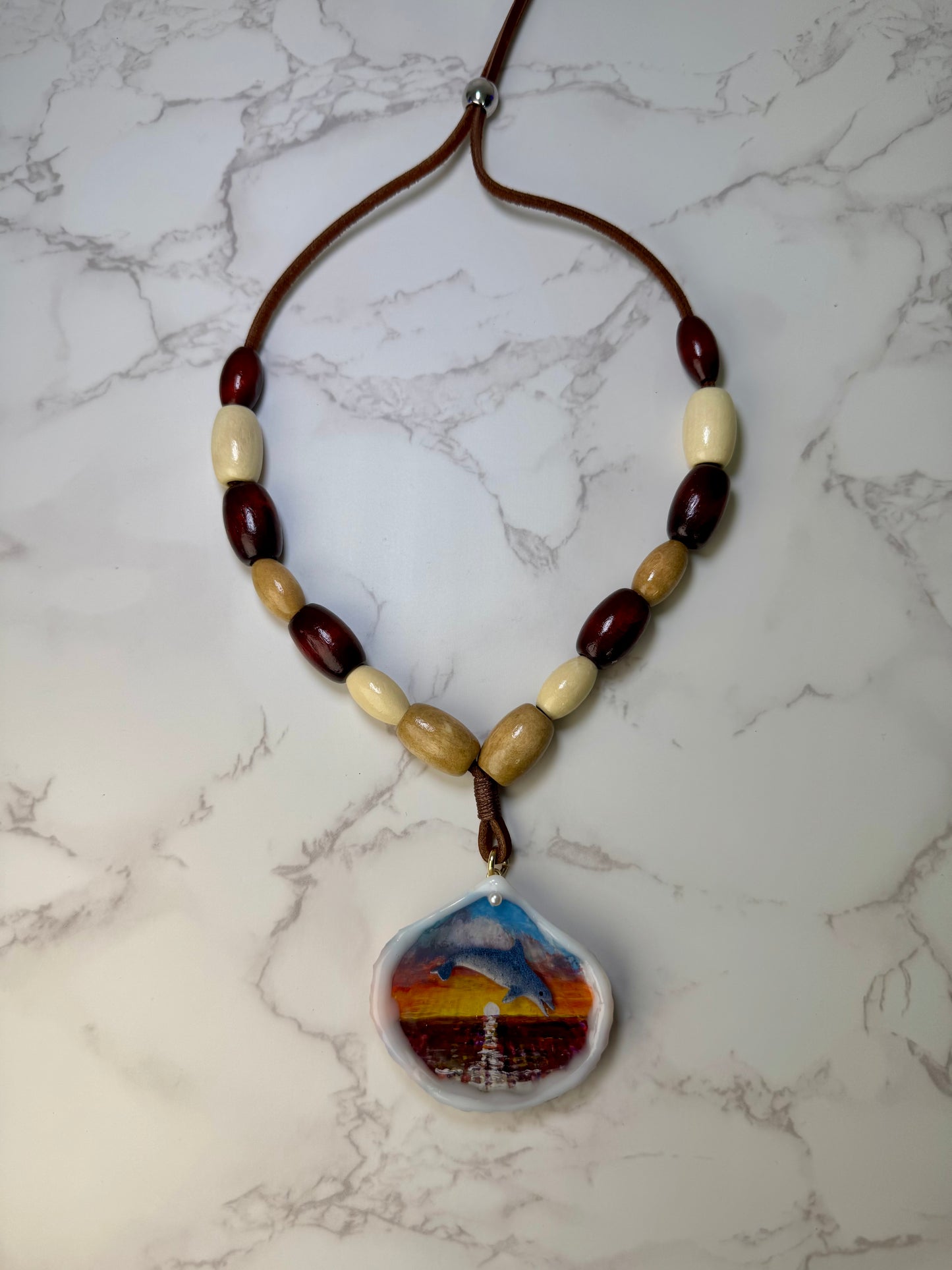 Beautiful Single Dolphin Necklace Handmade Dolphin Necklace Over Painted Ocean Sunset Encapsulated in Real Shell with UV Resin on Leather Cord