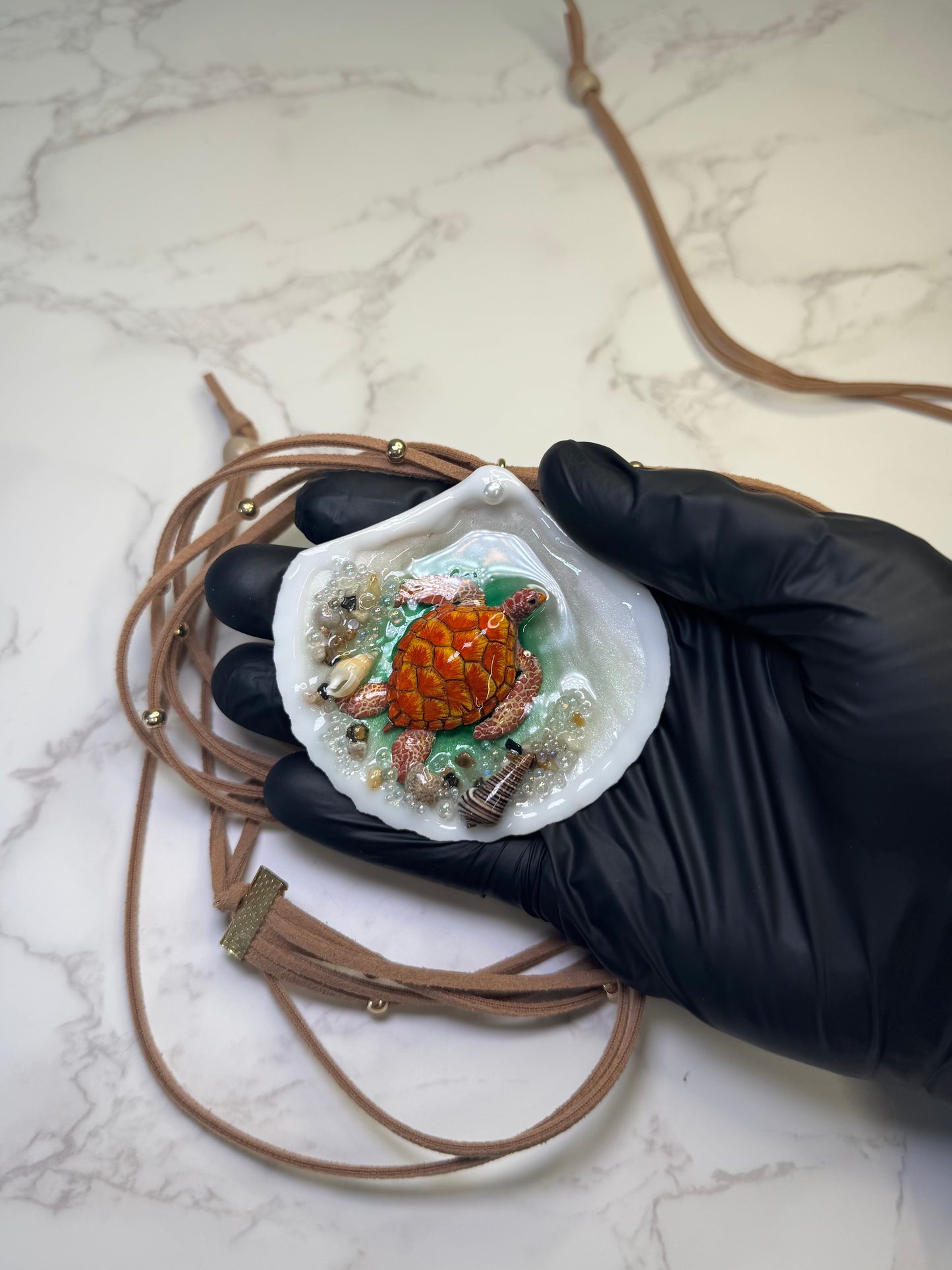 Sunfire Tides Natural seashell featuring a red-and-orange sea turtle, sand, and tiny seashells encapsulated in clear UV resin