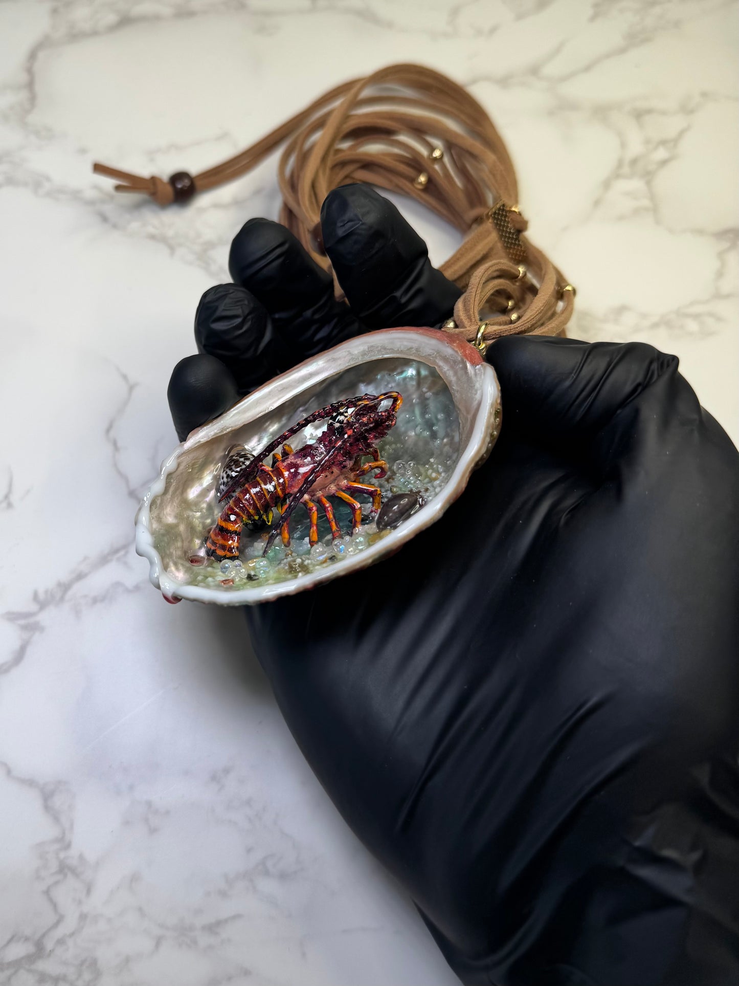 Crimson Tide Natural seashell featuring a miniature realistic lobster and tiny natural shells encapsulated in clear UV resin