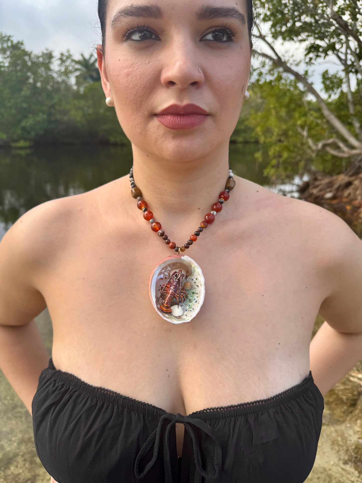 Scarlet Shore Vibrant red abalone seashell featuring a metal handmade craft realistic lobster, tiny natural shells, and a red crystal pendant encapsulated in clear UV resin