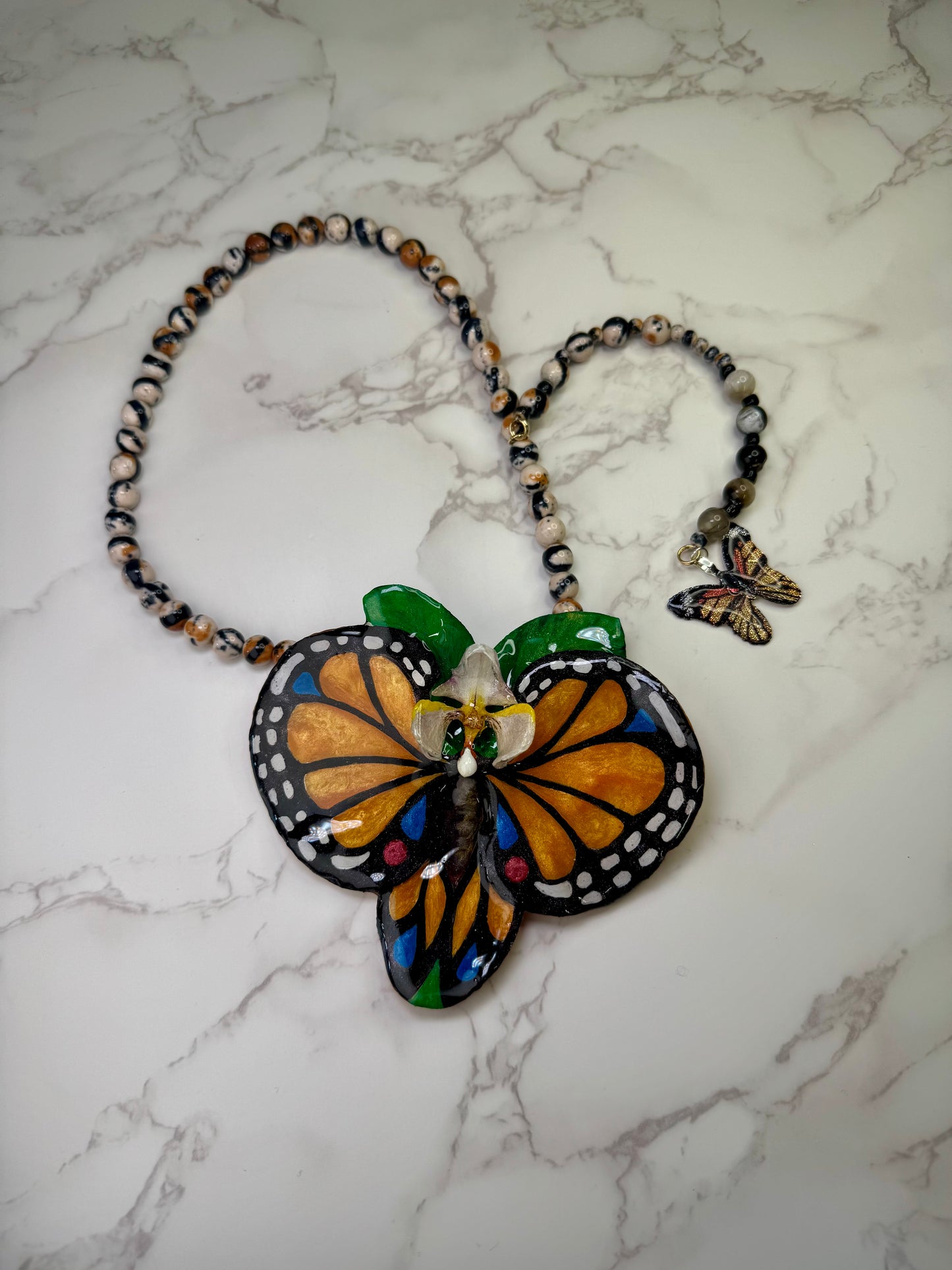 The Orange Wing – Orchid of the Whispering Leaf