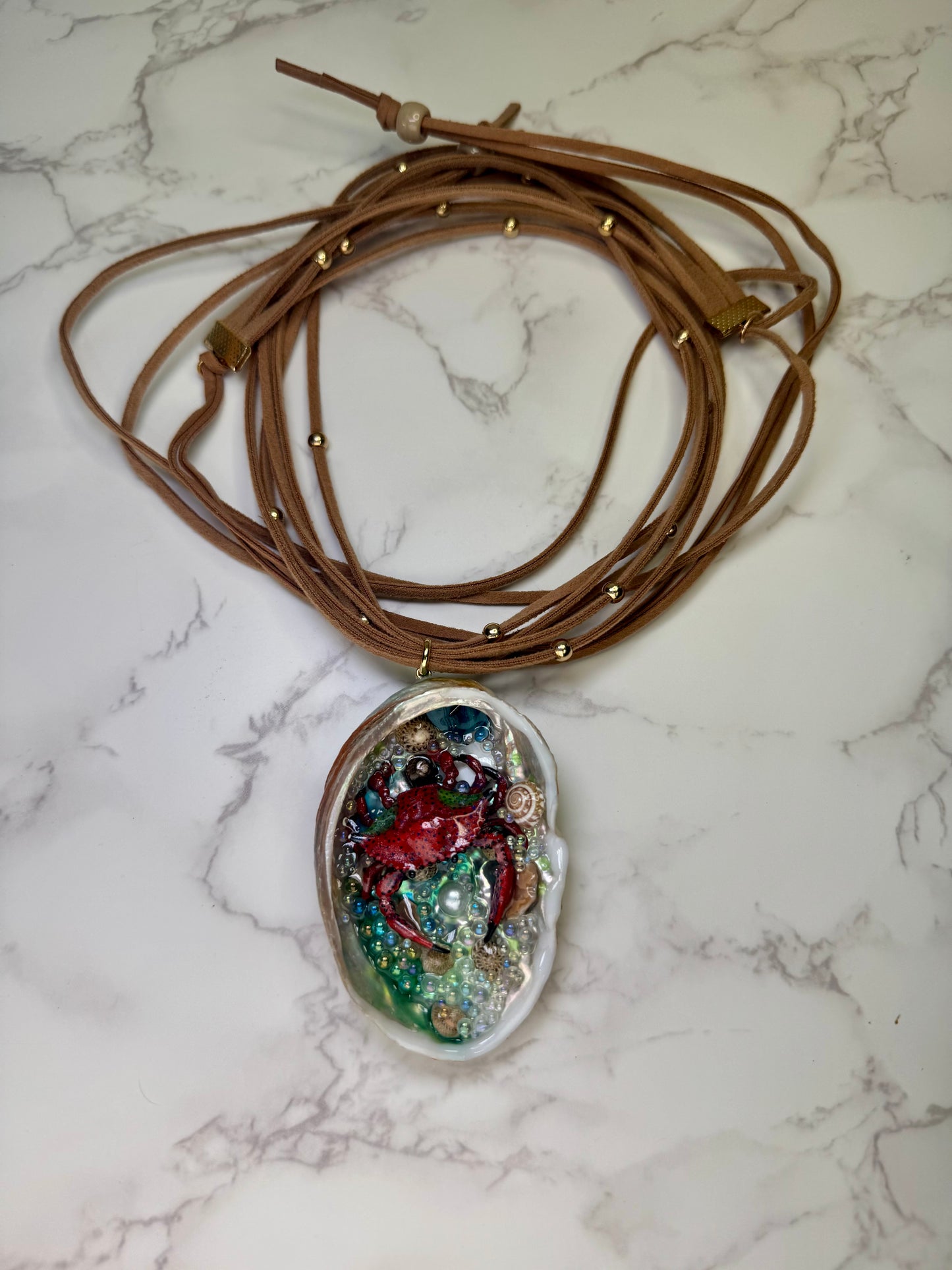 Crimson Cove Keeper Natural abalone seashell featuring a metal handmade red-and-black dotted crab, multiple tiny seashells, and small glass balls encapsulated in clear UV resin Beautiful extra large brown Leather Necklace