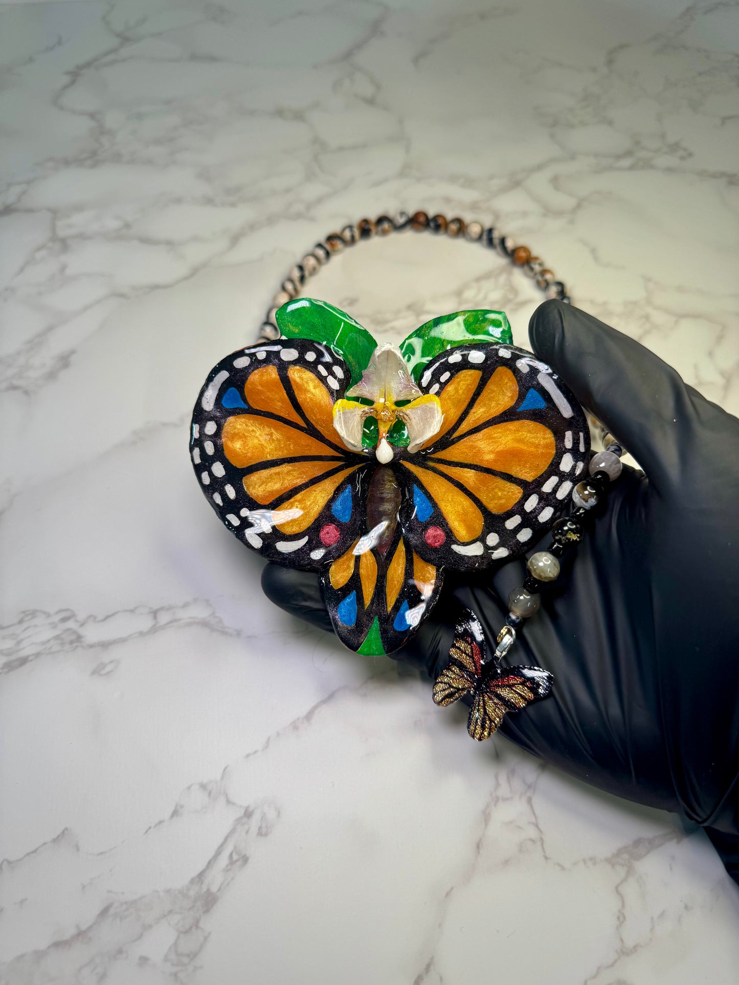 The Orange Wing – Orchid of the Whispering Leaf