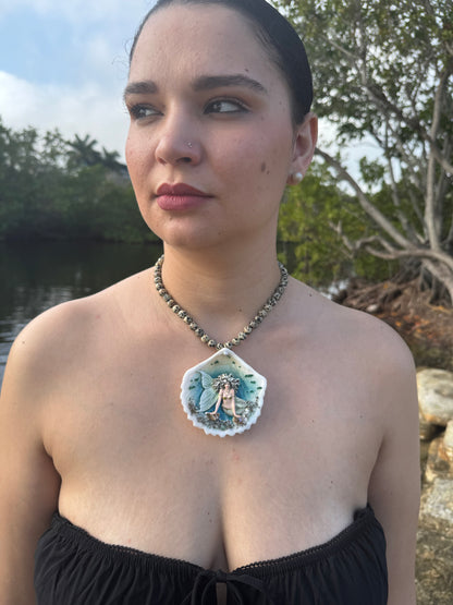Moonshell Siren Natural seashell featuring a handmade craft metal mermaid with white hair and a pearlescent white tail encapsulated in clear UV resin Beautiful semiprecious stones necklace