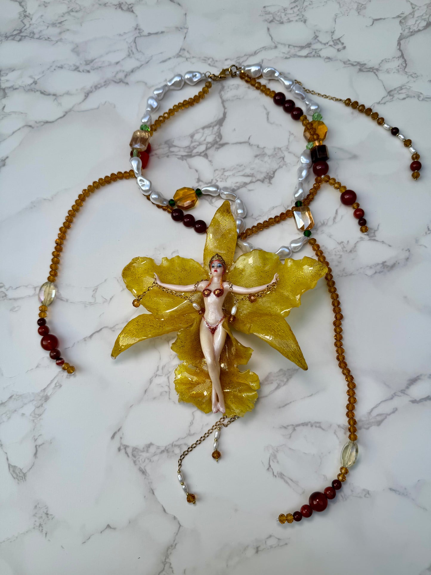 Aurelia – LIMITED EDITION – NYFW EXHIBITION PIECE Real Yellow Cattleya Orchid Necklace with Hand-Carved Female Figure, Amber Crystal and White Pearl Details