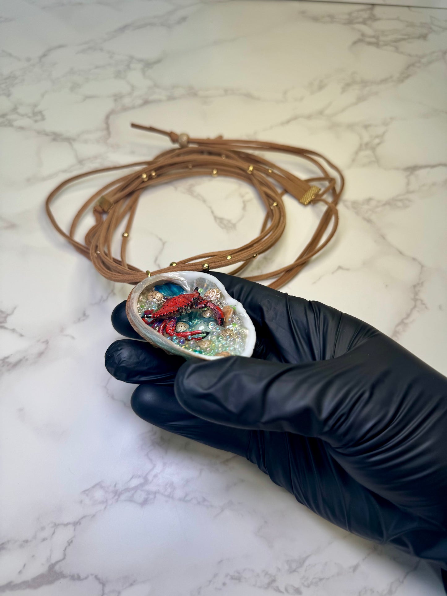 Crimson Cove Keeper Natural abalone seashell featuring a metal handmade red-and-black dotted crab, multiple tiny seashells, and small glass balls encapsulated in clear UV resin Beautiful extra large brown Leather Necklace