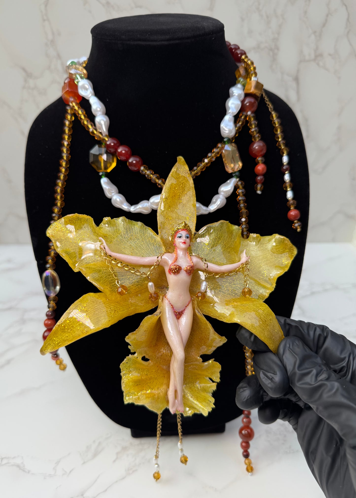 Aurelia – LIMITED EDITION – NYFW EXHIBITION PIECE Real Yellow Cattleya Orchid Necklace with Hand-Carved Female Figure, Amber Crystal and White Pearl Details