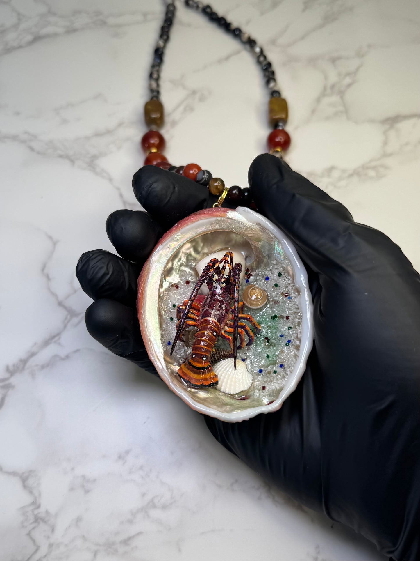 Scarlet Shore Vibrant red abalone seashell featuring a metal handmade craft realistic lobster, tiny natural shells, and a red crystal pendant encapsulated in clear UV resin Limited Edition