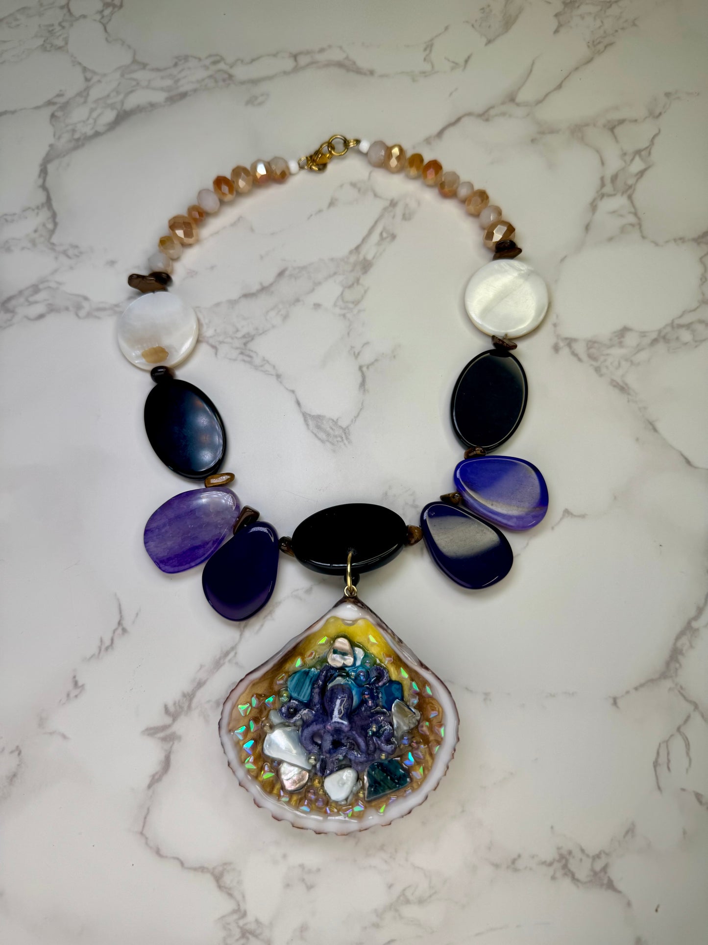 Violet Reef Whisper Natural seashell featuring a handmade metal purple octopus and colorful coral pieces encapsulated in clear UV resin Beautiful combined necklace