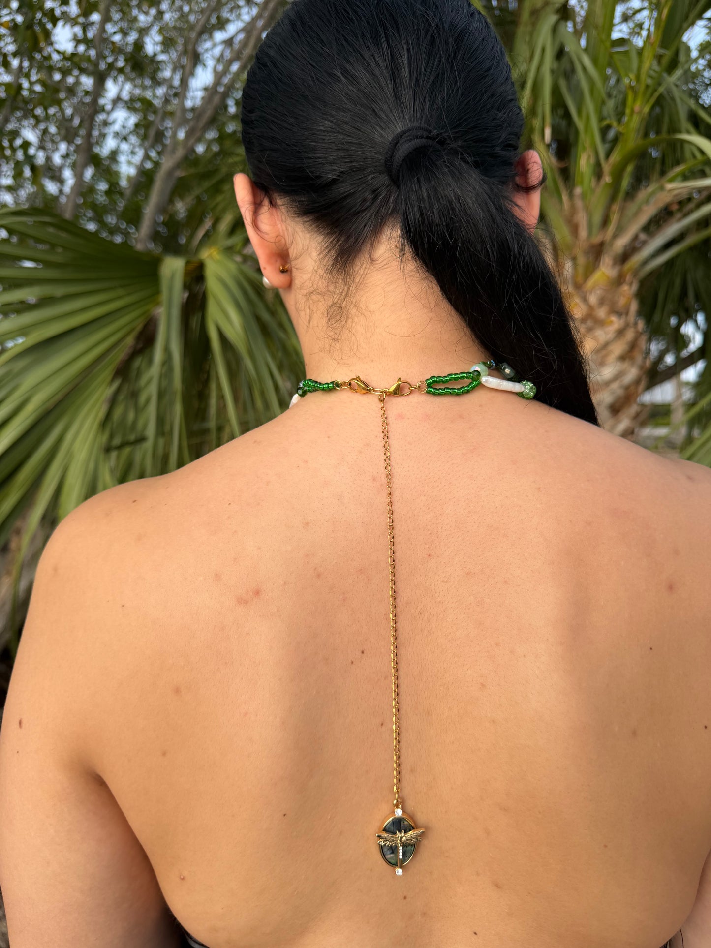 Golden Twin Orchid Grace Two Mini Orchid Orchid Necklace – Green Crystals, Long Pearls, Crystal Heart & Dragonfly on Green Mother-of-Pearl Extension
