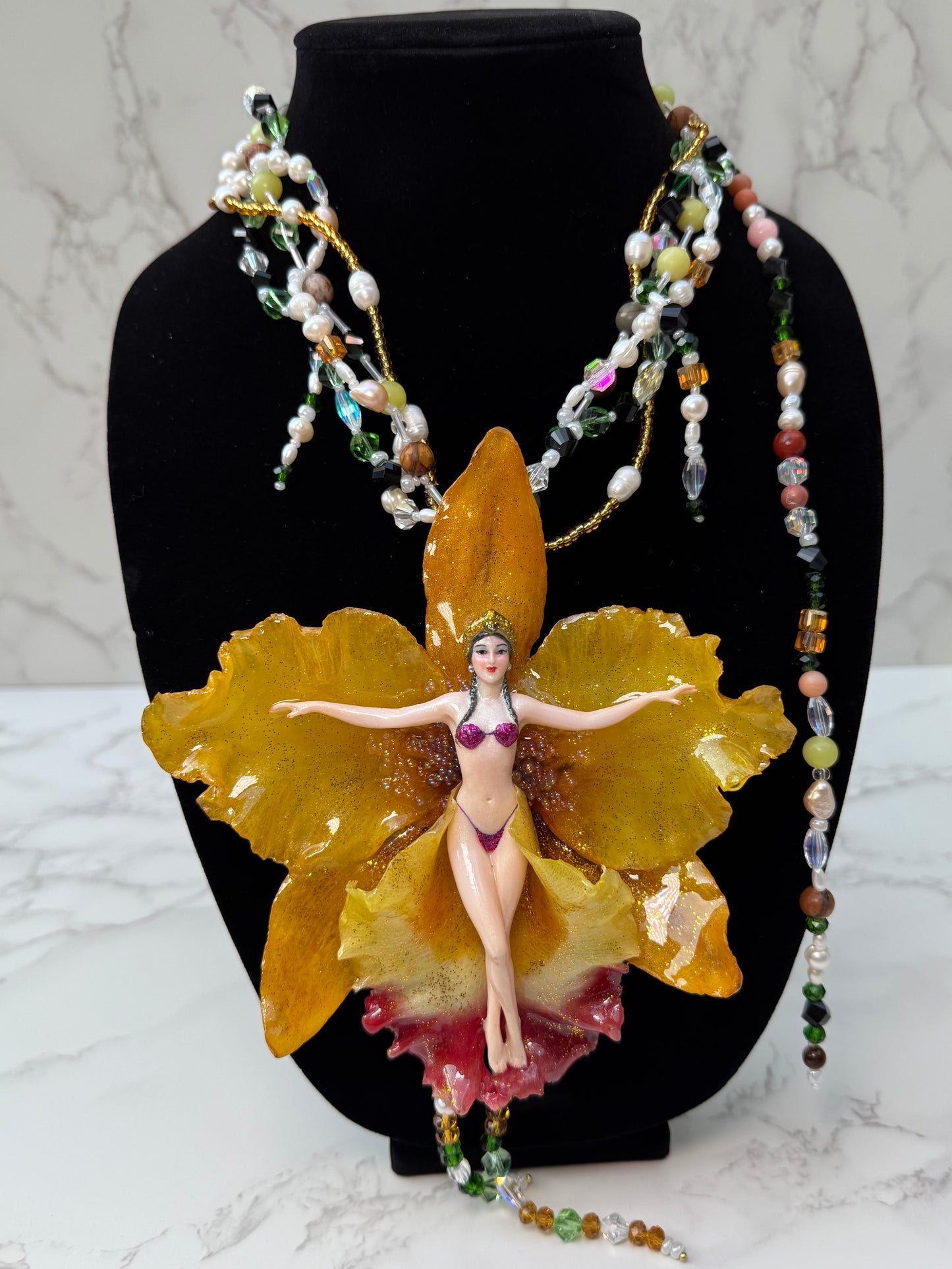 Helia – LIMITED EDITION – NYFW EXHIBITION PIECE Handmade Real Yellow Orchid Art Necklace with Hand-Carved Female Figure, Freshwater Pearls and Multitone Crystal Details