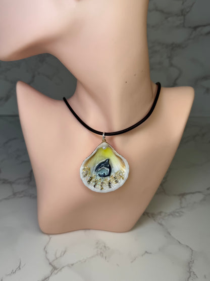 Mini Tide Hunter Tiny natural seashell featuring a handmade craft metal miniature shark and small crystals encapsulated in clear UV resin.  Leather necklace