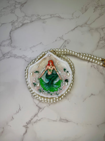 Emerald Siren Whisper Natural seashell featuring a handmade craft metal mermaid with orange hair and a shimmering green tail encapsulated in clear UV resin Beautiful extra long Glasses Pearls Necklace