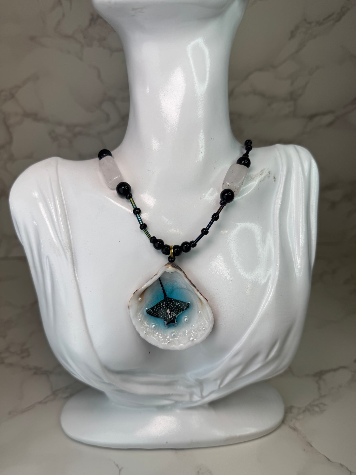 Shadow Tide Natural seashell featuring a handmade craft miniature black manta ray and a black-and-white crystal pendant encapsulated in clear UV resin Beautiful semiprecious beads necklace
