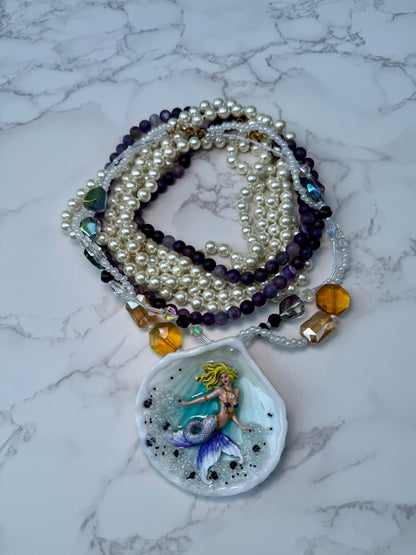 Aqualis – LIMITED EDITION – NYFW EXHIBITION PIECE Natural Seashell Art Necklace with Hand-Carved White-to-Purple Mermaid, Clear Crystals, Black Accents and Purple & Amber Crystal Necklace