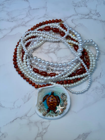 Tyrionis – LIMITED EDITION – NYFW EXHIBITION PIECE Handmade Natural Seashell Necklace with Handcrafted Brown Sea Turtle, Natural Sand, Starfish and Shell Accents, Brown, Red & Crimson Glass Beads and Crystal Pearls
