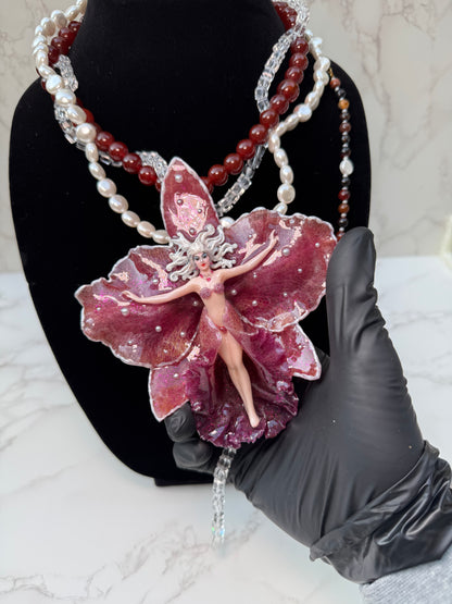Calista – LIMITED EDITION – NYFW EXHIBITION PIECE Real Dark Purple Orchid with White Edges, Hand-Carved Female Figure, Mother-of-Pearl, Freshwater Pearls and Clear & Crimson Crystal Necklace