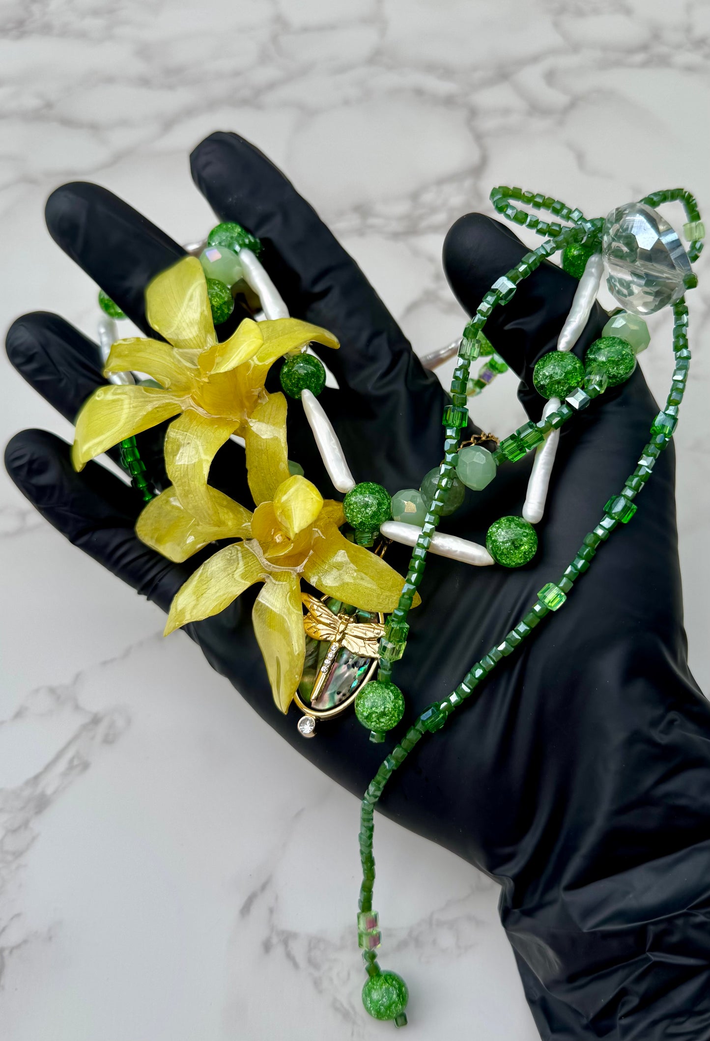 Golden Twin Orchid Grace Two Mini Orchid Orchid Necklace – Green Crystals, Long Pearls, Crystal Heart & Dragonfly on Green Mother-of-Pearl Extension