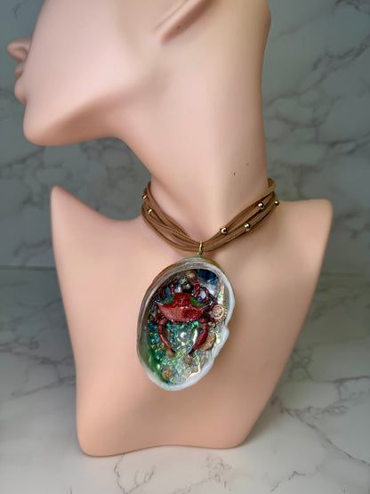 Crimson Cove Keeper Natural abalone seashell featuring a metal handmade red-and-black dotted crab, multiple tiny seashells, and small glass balls encapsulated in clear UV resin Beautiful extra large brown Leather Necklace