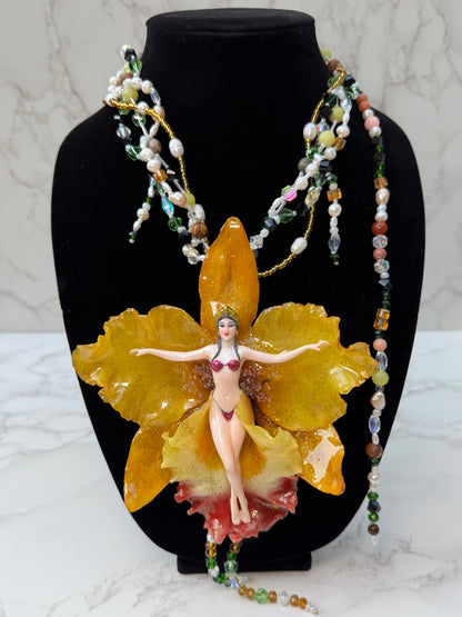 Helia – LIMITED EDITION – NYFW EXHIBITION PIECE Handmade Real Yellow Orchid Art Necklace with Hand-Carved Female Figure, Freshwater Pearls and Multitone Crystal Details