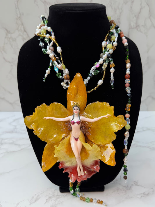 Helia – LIMITED EDITION – NYFW EXHIBITION PIECE Handmade Real Yellow Orchid Art Necklace with Hand-Carved Female Figure, Freshwater Pearls and Multitone Crystal Details