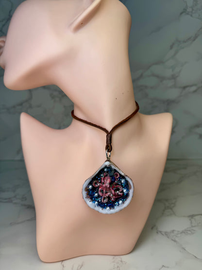 Crimson Pearl Drift Natural seashell featuring a beautiful handmade metal red octopus, blue sparkled rocks, and imitation pearls encapsulated in clear UV resin Leather necklace