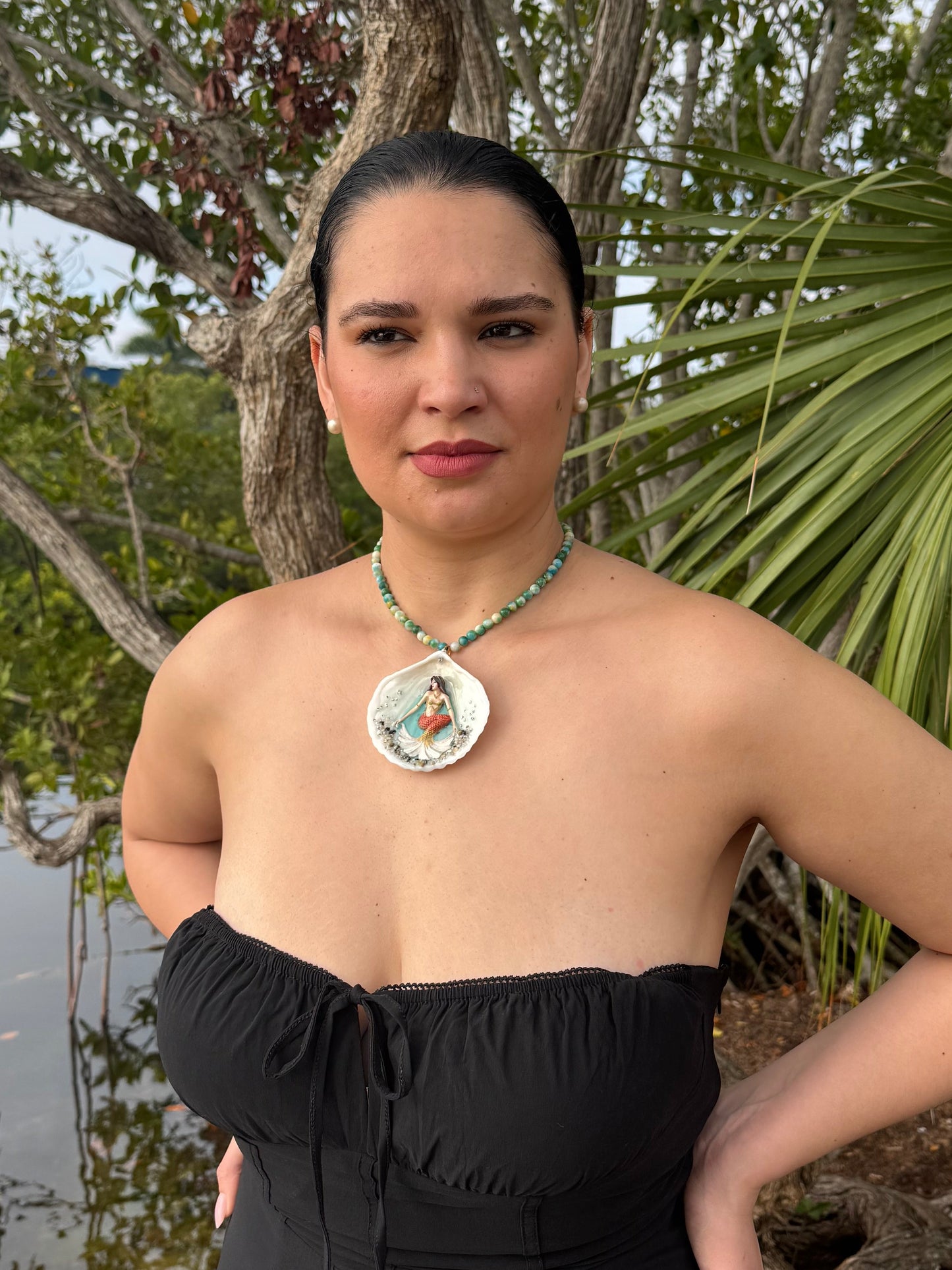 Sunlit Coral Siren Natural seashell featuring a handmade craft metal mermaid with brown hair, yellow highlights, and an orange–yellow tail encapsulated in clear UV resin Beautiful semiprecious stones necklace