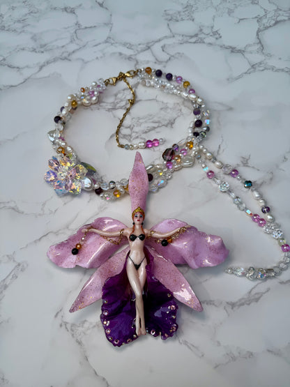 Nyx- LIMITED EDITION – NYFW EXHIBITION PIECE Real Purple and Light Pink Cattleya Orchid Necklace with Hand-Carved Female Figure, with Clear Crystals, Pink Details and Freshwater Pearls