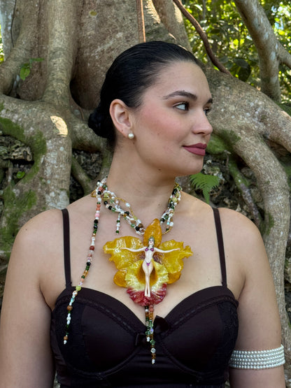 Helia – LIMITED EDITION – NYFW EXHIBITION PIECE Handmade Real Yellow Orchid Art Necklace with Hand-Carved Female Figure, Freshwater Pearls and Multitone Crystal Details