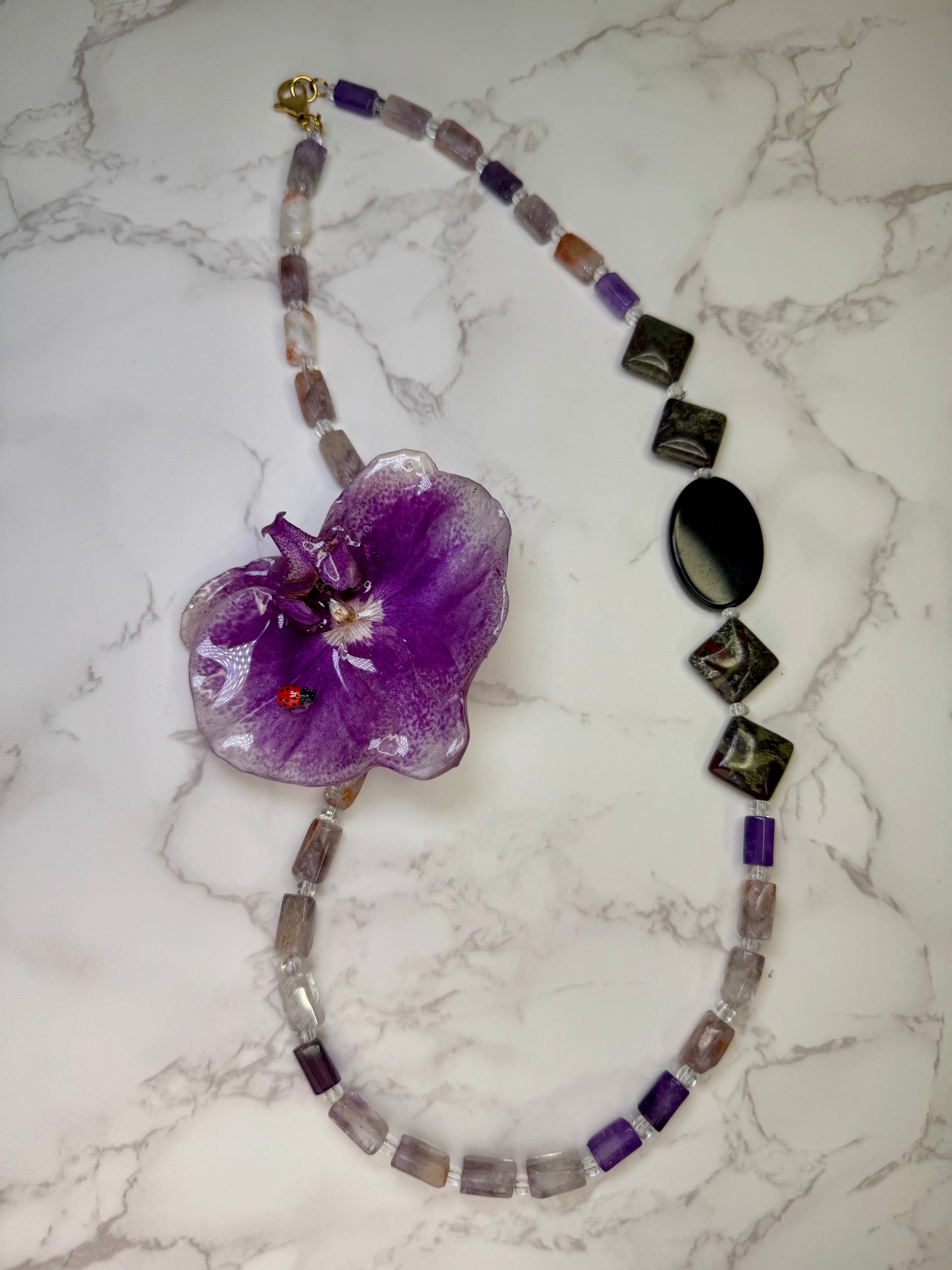Violet Petal Charm Natural Flower Preserved in Resin Purple-and-white real orchid flower centerpiece with a tiny red ladybug Beautiful Natural Stones Necklace