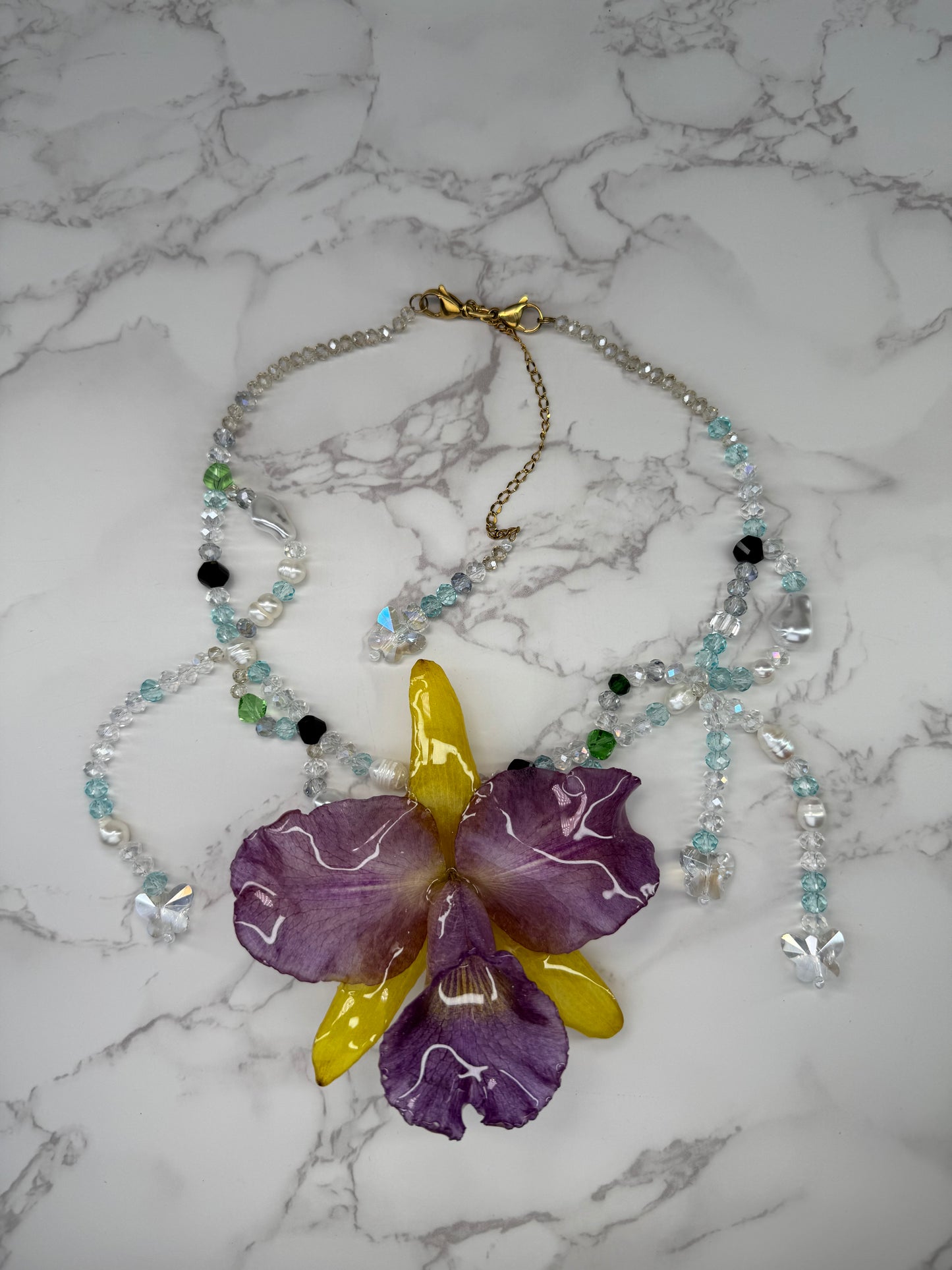 Oceanlight Cattleya Bloom Purple & Yellow Cattleya Orchid Necklace – Clear & Light Blue Crystal Beads
