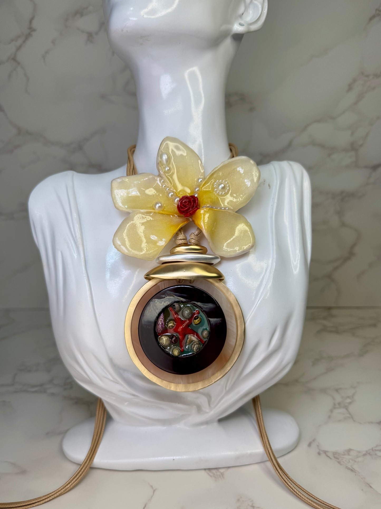 Sunlit Rose Tide Yellow flower with a miniature red rose center