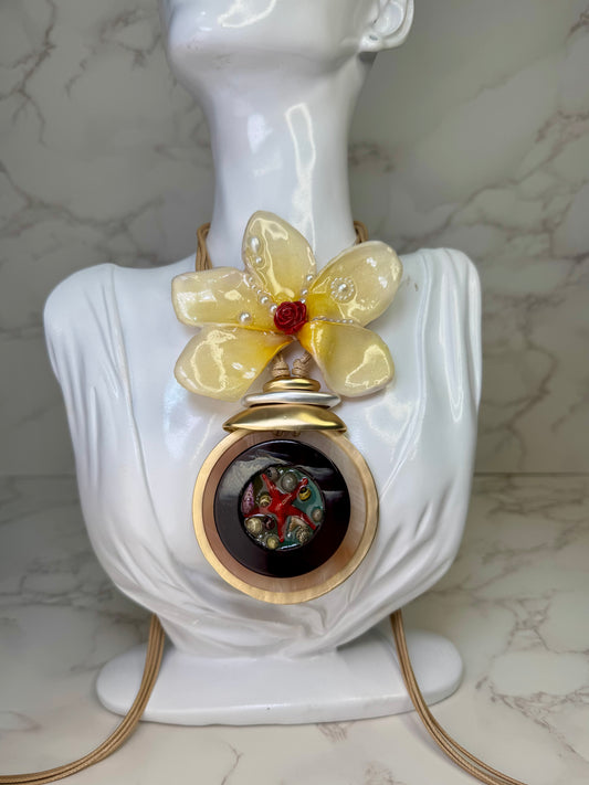 Sunlit Rose Tide Yellow flower with a miniature red rose center