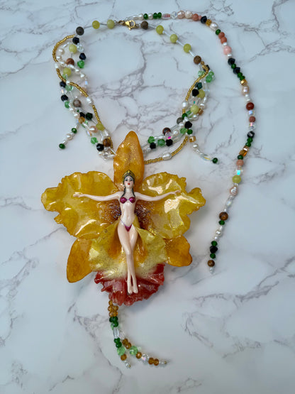 Helia – LIMITED EDITION – NYFW EXHIBITION PIECE Handmade Real Yellow Orchid Art Necklace with Hand-Carved Female Figure, Freshwater Pearls and Multitone Crystal Details