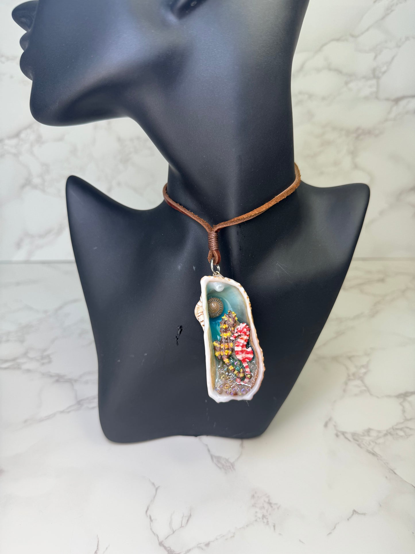 Seabreeze Serenade Exotic natural seashell featuring two silver 925 miniature seahorses (yellow–brown &amp; white–red), tiny clear balls, and sand encapsulated in clear UV resin