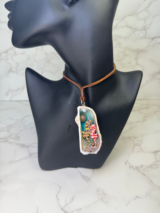 Seabreeze Serenade Exotic natural seashell featuring two silver 925 miniature seahorses (yellow–brown &amp; white–red), tiny clear balls, and sand encapsulated in clear UV resin