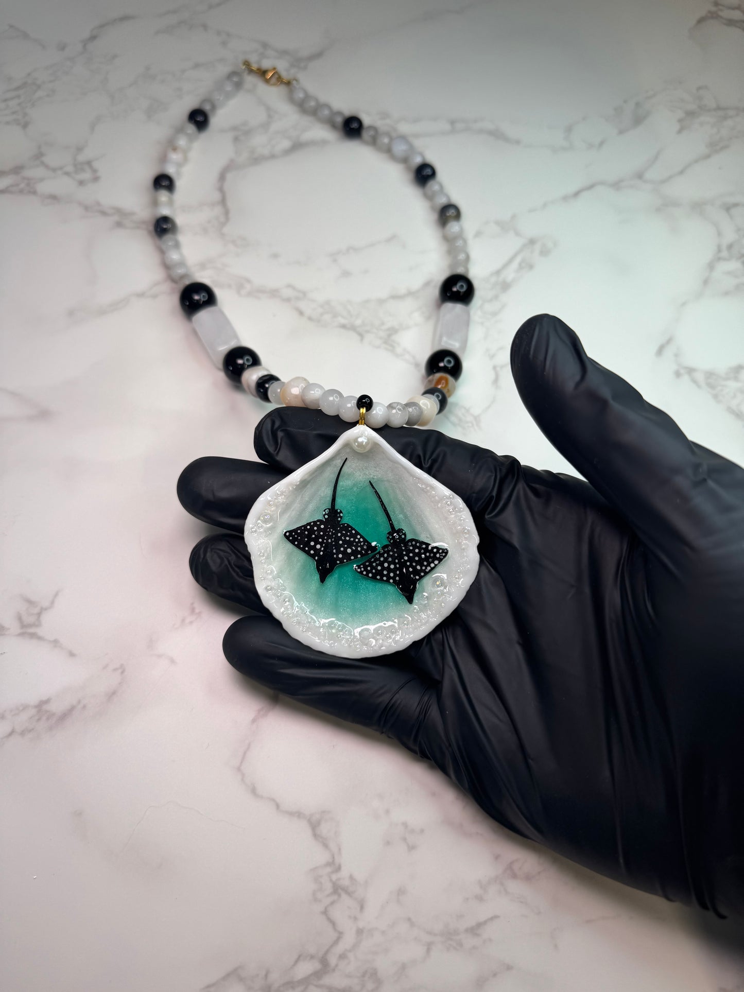 Midnight Current Natural seashell featuring two metal handmade craft miniature black manta rays and a white-and-black crystal pendant encapsulated in clear UV resin Beautiful Natural stones necklace
