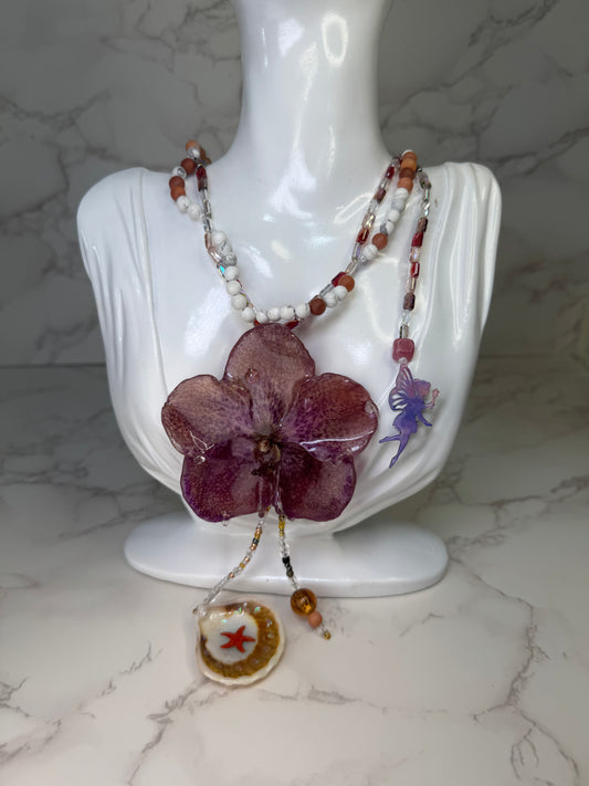 Enchanted Orchid Wishes Natural Flower Preserved in Resin Real Purple-and-red banda orchid flower centerpiece Stones -Glasses Necklace with Tinkerbell Added in the necklace and Combined  with a Starfish in a Natural Shell