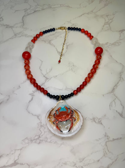Fire Tide Sentinel Natural seashell featuring a handmade craft metal red-and-black spotted crab. Beautiful semiprecious Stones Necklace