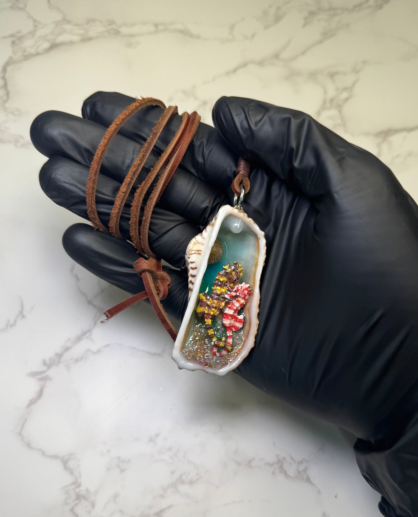 Seabreeze Serenade Exotic natural seashell featuring two silver 925 miniature seahorses (yellow–brown &amp; white–red), tiny clear balls, and sand encapsulated in clear UV resin