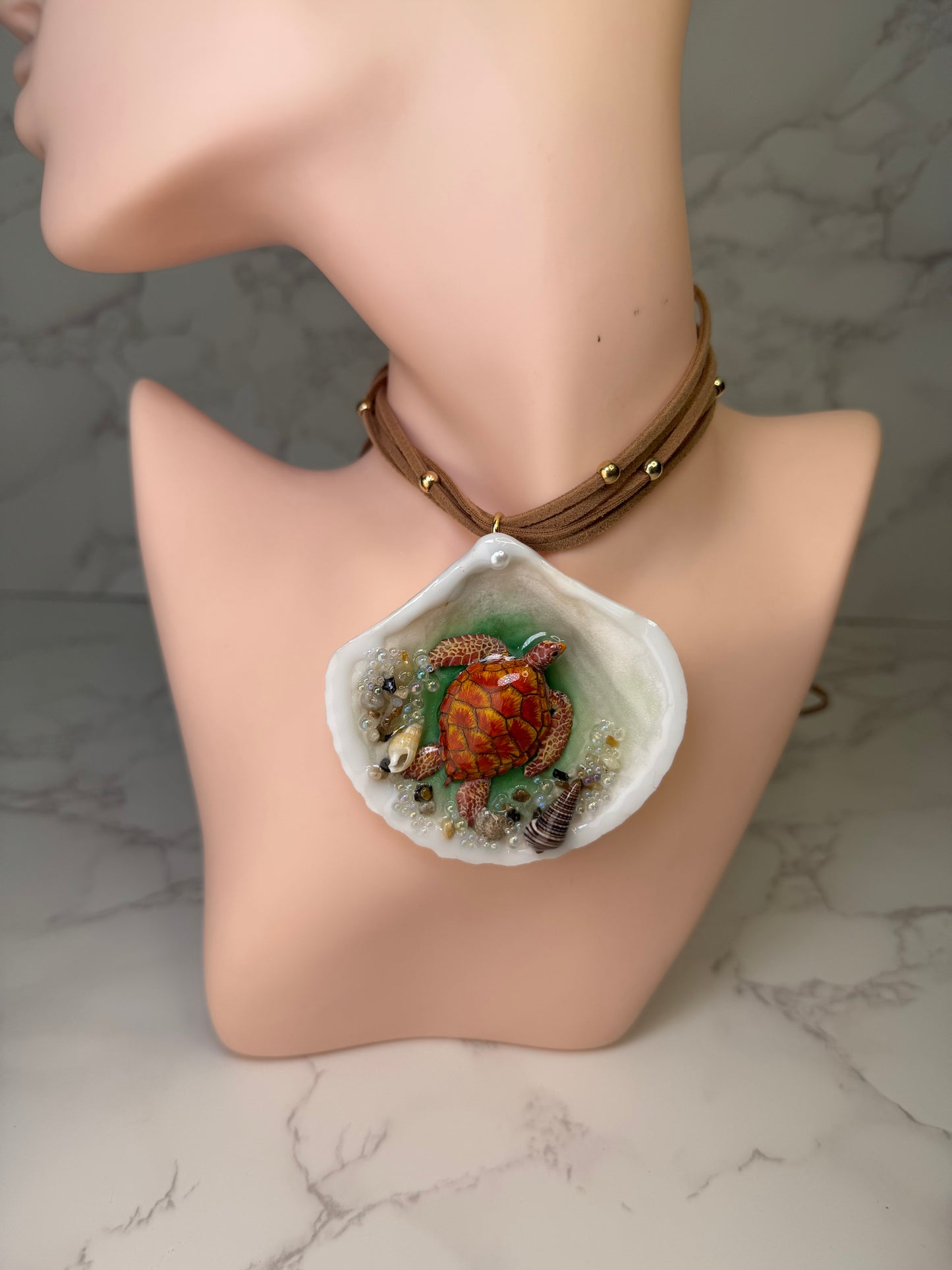 Sunfire Tides Natural seashell featuring a red-and-orange sea turtle, sand, and tiny seashells encapsulated in clear UV resin