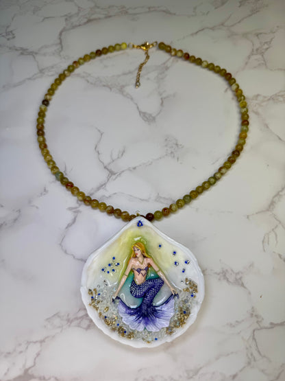 Bluewave Siren Natural seashell featuring a handmade crafted metal mermaid with blonde hair and a shimmering blue tail encapsulated in clear UV resin Beautiful Natural Stones Beads Necklace