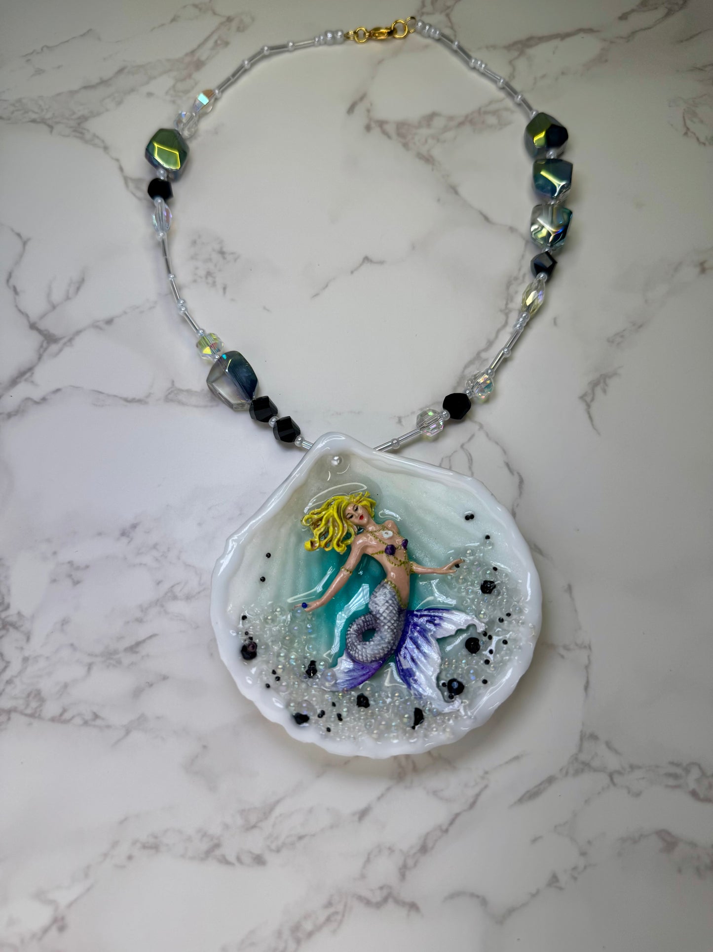 Lavender Tides Mermaid Natural seashell featuring a handmade crafted blonde mermaid with a white-and-purple shimmering tail encapsulated in clear UV resin Beauty Natural Necklace