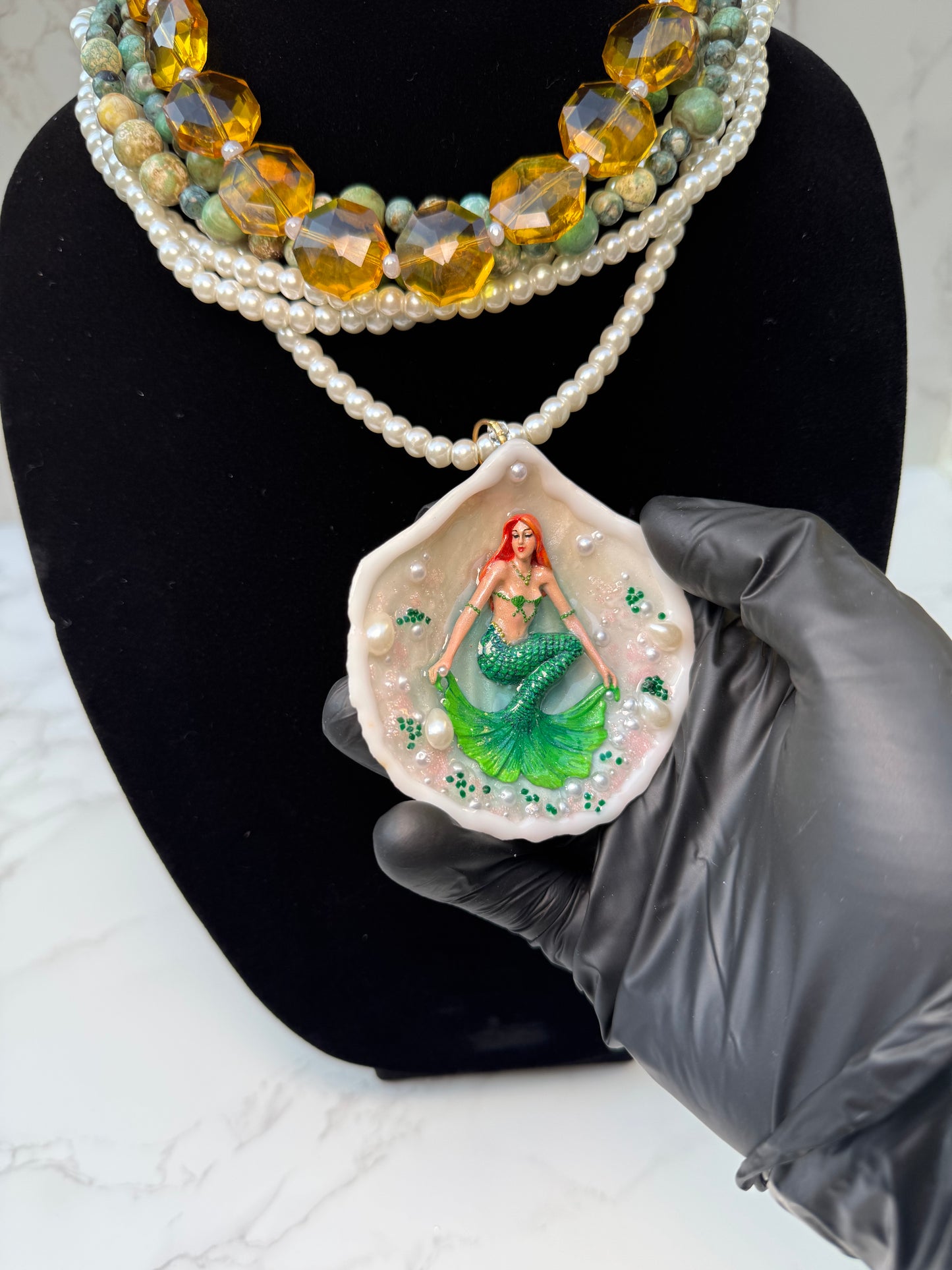 Caelara – LIMITED EDITION – NYFW EXHIBITION PIECE Natural Seashell Art Necklace with Hand-Carved Green Mermaid, Pearl and Crystal Details, Green and Amber Beaded Crystal Necklace