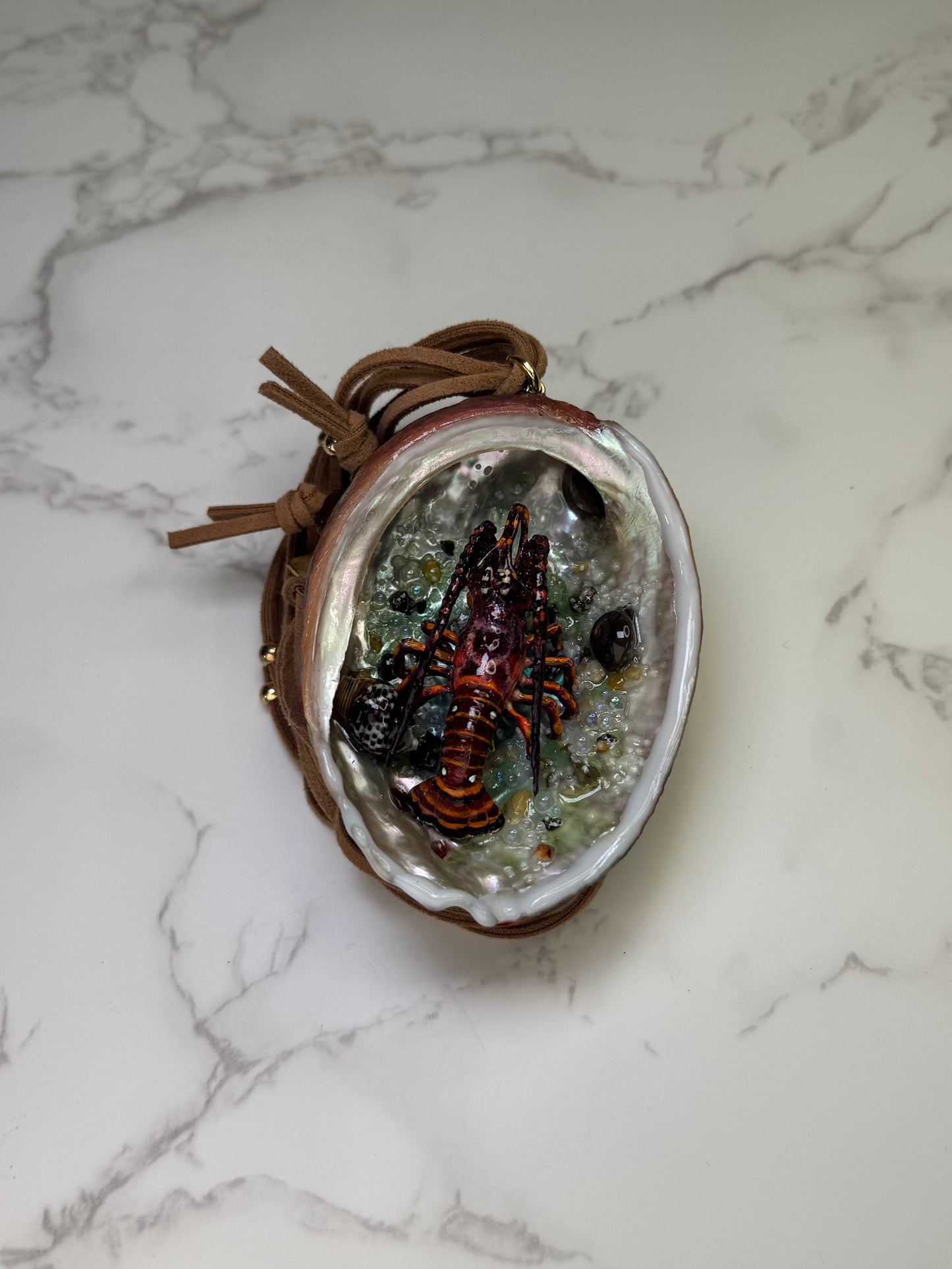 Crimson Tide Natural seashell featuring a miniature realistic lobster and tiny natural shells encapsulated in clear UV resin