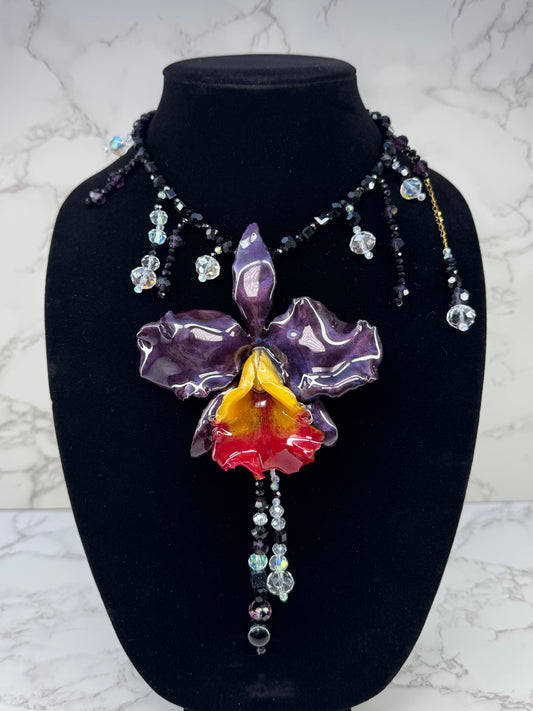 Midnight Cattleya Radiance Golden & Dark Purple Cattleya Orchid Necklace – Black Crystal Beads with Clear Crystal Accents