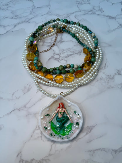 Caelara – LIMITED EDITION – NYFW EXHIBITION PIECE Natural Seashell Art Necklace with Hand-Carved Green Mermaid, Pearl and Crystal Details, Green and Amber Beaded Crystal Necklace