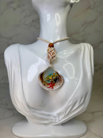 Sunny Shore Drift Natural seashell featuring a handmade metal yellow pufferfish with black spots, tiny red starfish, and delicate sand bits preserved in clear UV resin Beautiful corded necklace