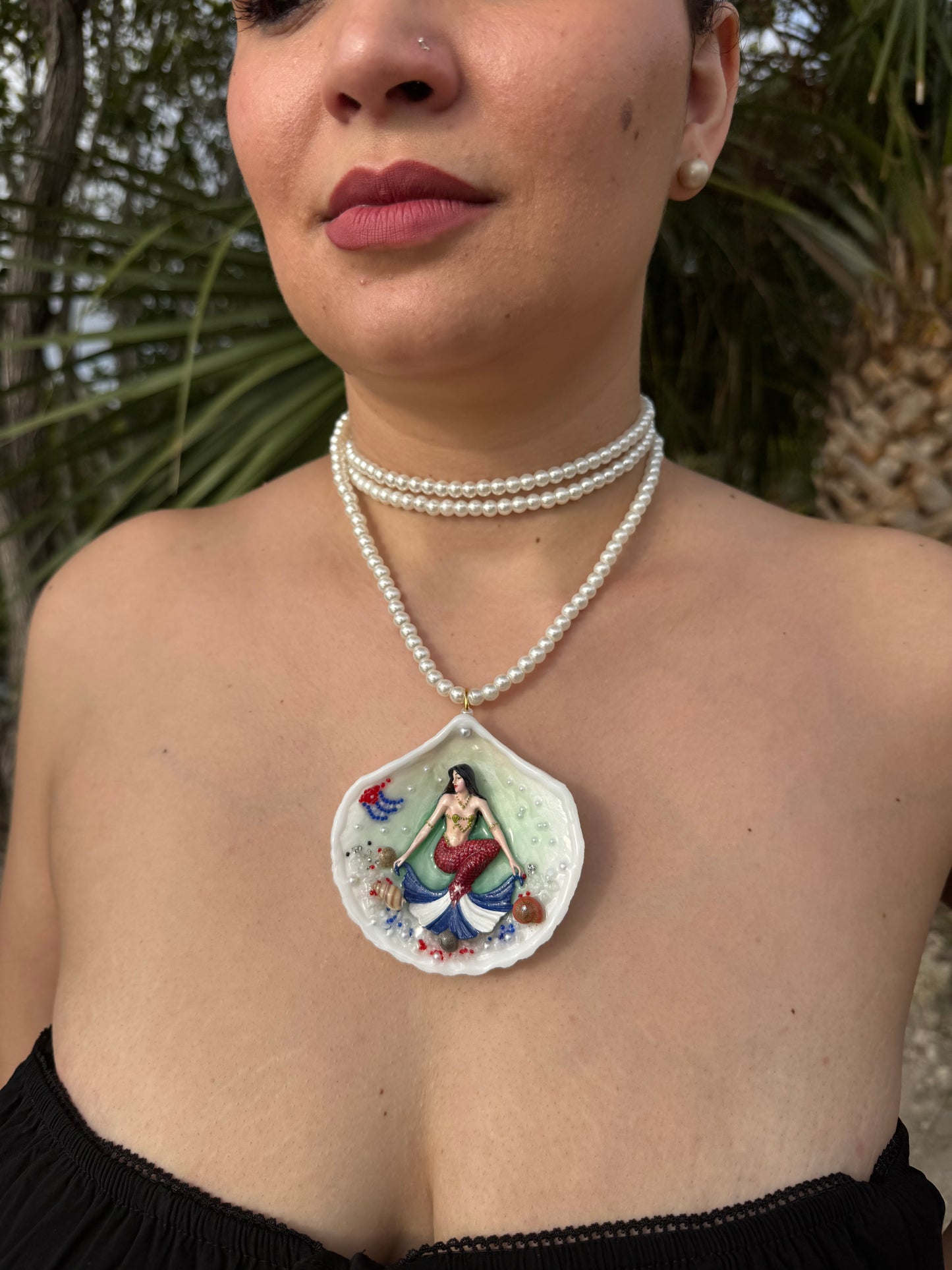 Cuba Libre Mermaid Natural seashell featuring a handmade craft metal mermaid with brown hair and a red tail inspired by the Cuban flag preserved in UV resin Beautiful Stones Necklace Handmade craft jewelry Crystal Pearl Necklace