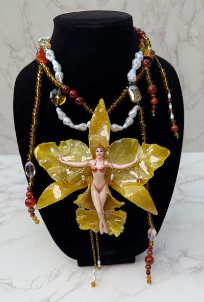 Aurelia – LIMITED EDITION – NYFW EXHIBITION PIECE Real Yellow Cattleya Orchid Necklace with Hand-Carved Female Figure, Amber Crystal and White Pearl Details